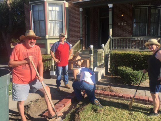 Left to right installing bricks are Michael Betcher, Dave Simas, Dean Lahodny, and Jeanine Simas.